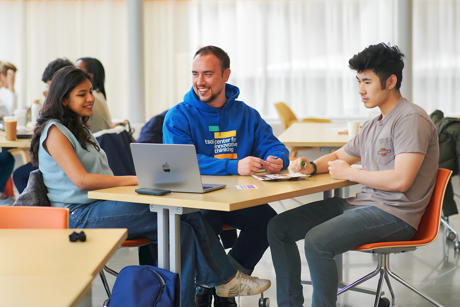 SAB students reading computer screen