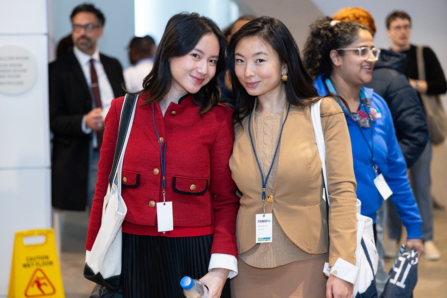 two asian women smiling into the camera