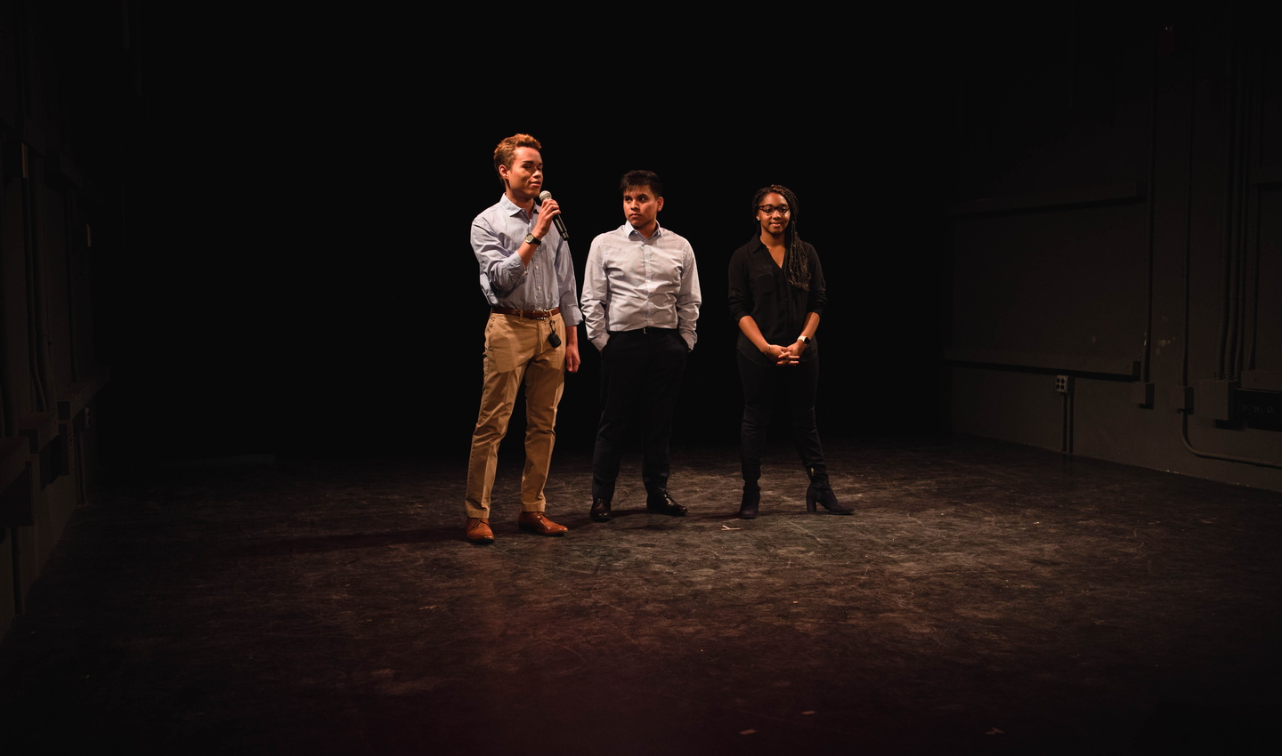 Three students pitch idea onstage