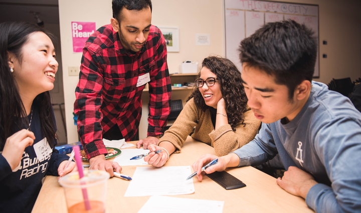 Small group of Student Advisory Board members work at table