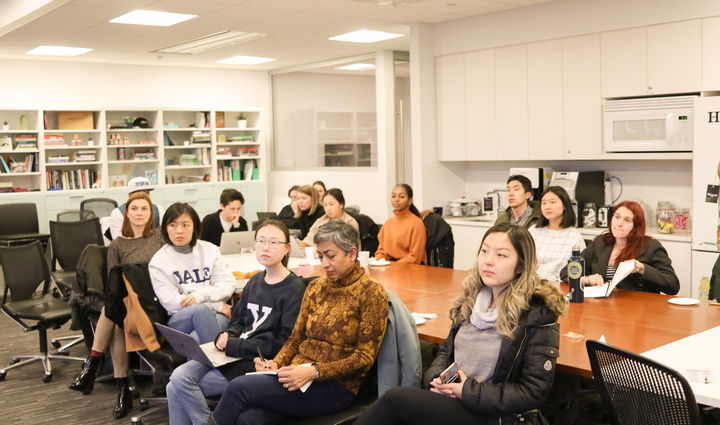 Group gathered around table at WE@Yale event