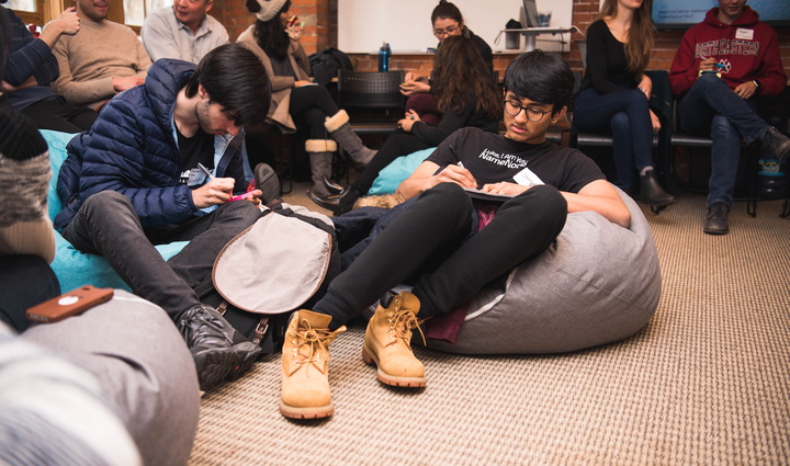 Students sit on beanbags and brainstorm during accelerator session