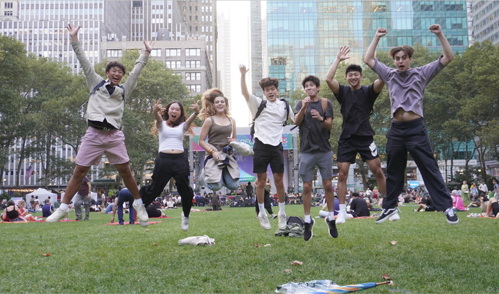 students jumping in the air happily