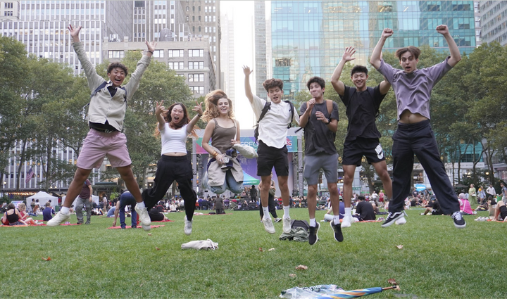 students jumping in the air happily 