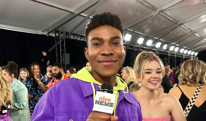 black man standing with a microphone in hand 