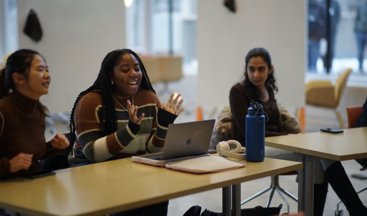 Laptop student group laughing