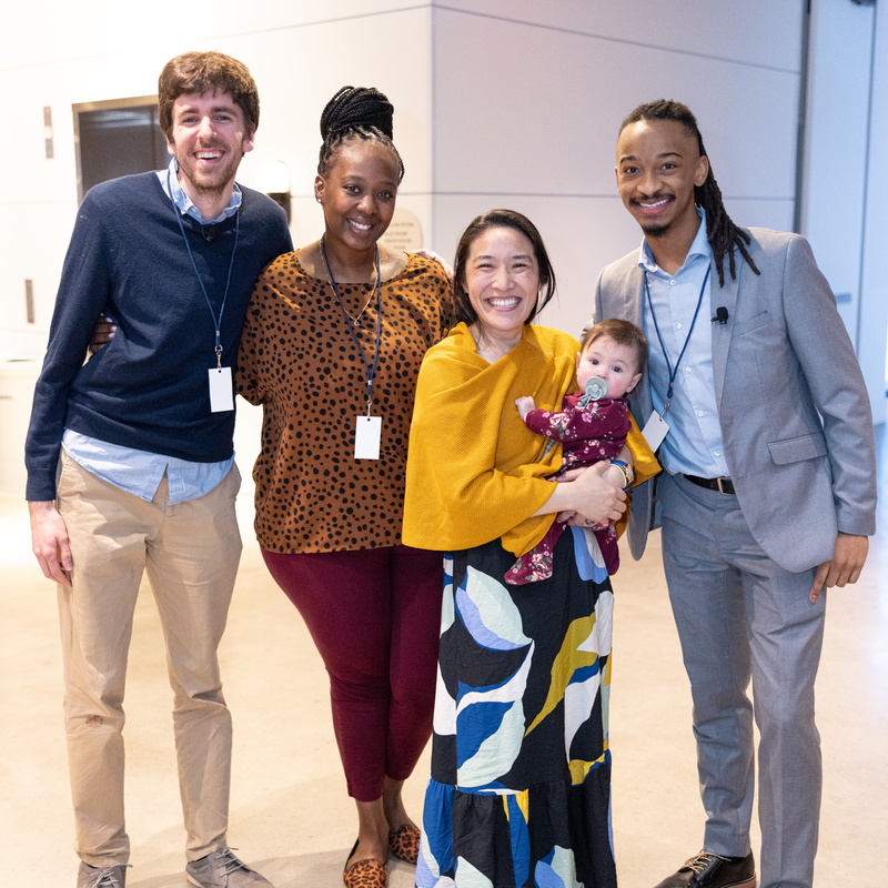 group of diverse individuals posing for the camera 