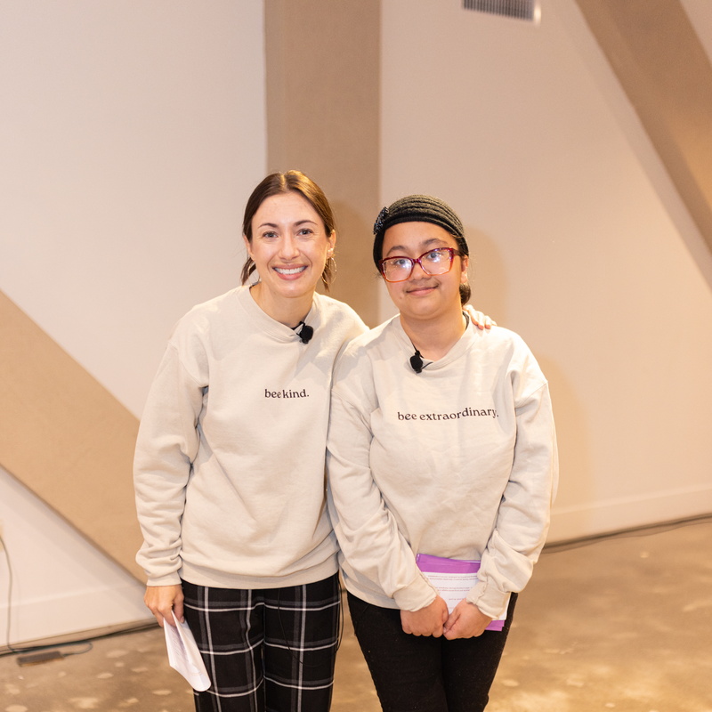 two girls smiling for the camera 