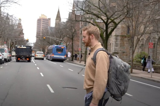 Ben Christensen walks across street in video screenshot