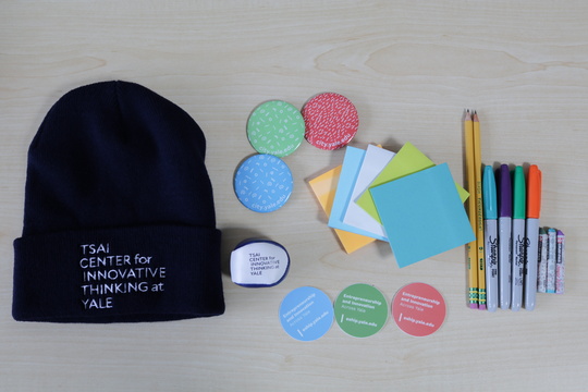 Flatlay image of Tsai CITY swag and office supplies