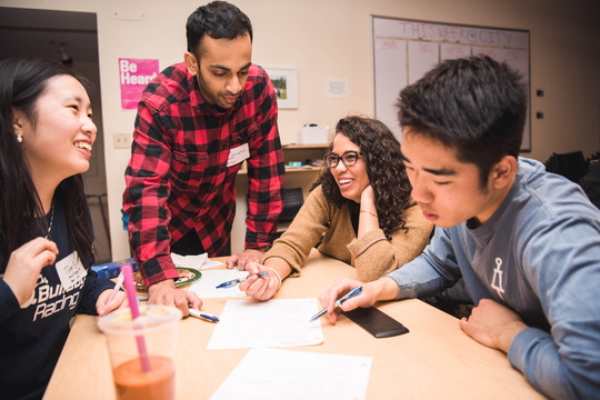 Small group of Student Advisory Board members work at table