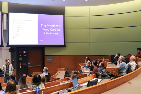 Students present on food carbon emissions in lecture hall