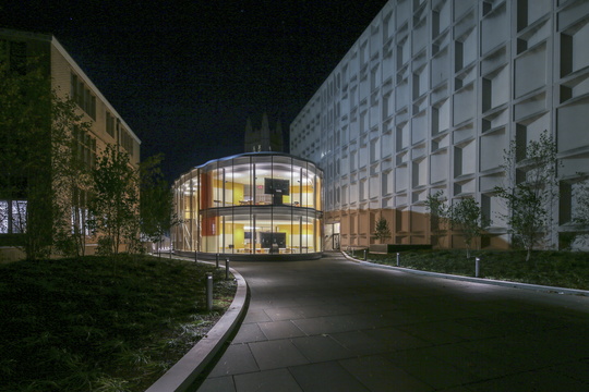 Nighttime view of exterior of Tsai CITY building