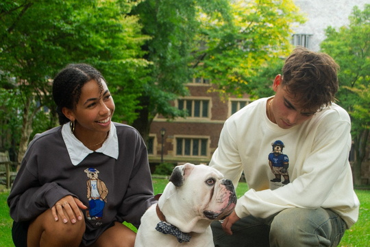 students posing with crew dog sweatshirts and handsome dan