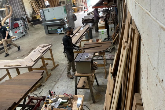 man cutting wood